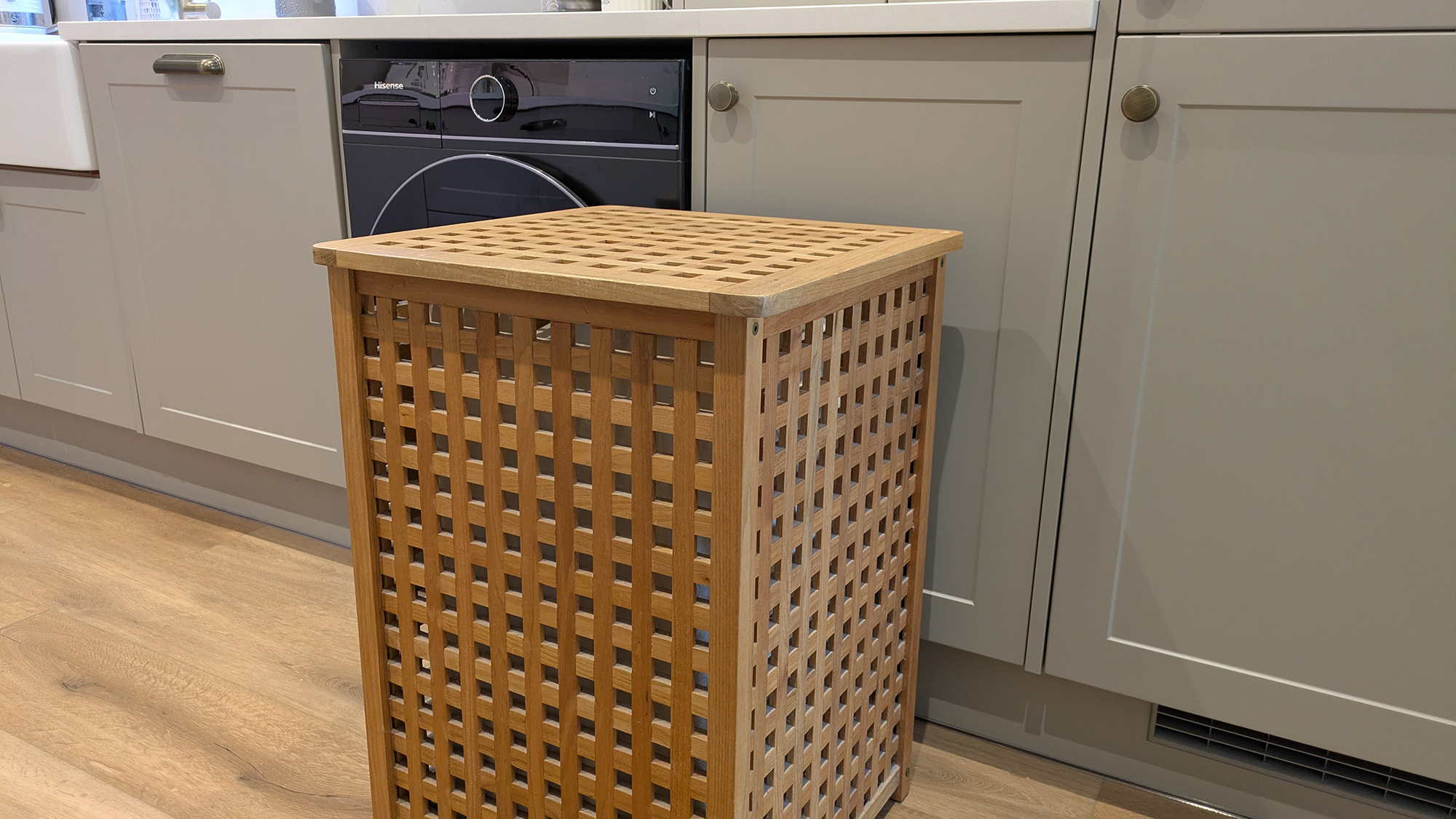 Wooden laundry basket in kitchen