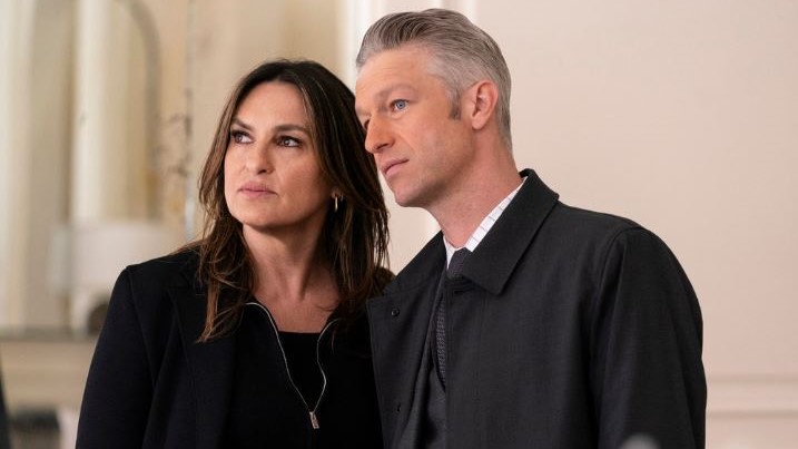 Mariska Hargitay and Peter Scanavino as Olivia and Carisi standing next to each other in Law &amp; Order: SVU season 26 episode 21