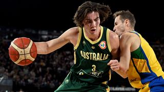 Josh Giddey (L) #3 of the Australia Men's National Team dribbles the ball during the 2023 FIBA Basketball World Cup