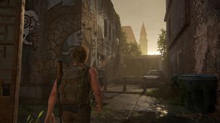 Abby walking down a back street in The Last of Us Part 2 Remastered