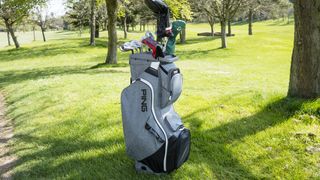 Ping Traverse 2022 Cart Bag resting on the golf course