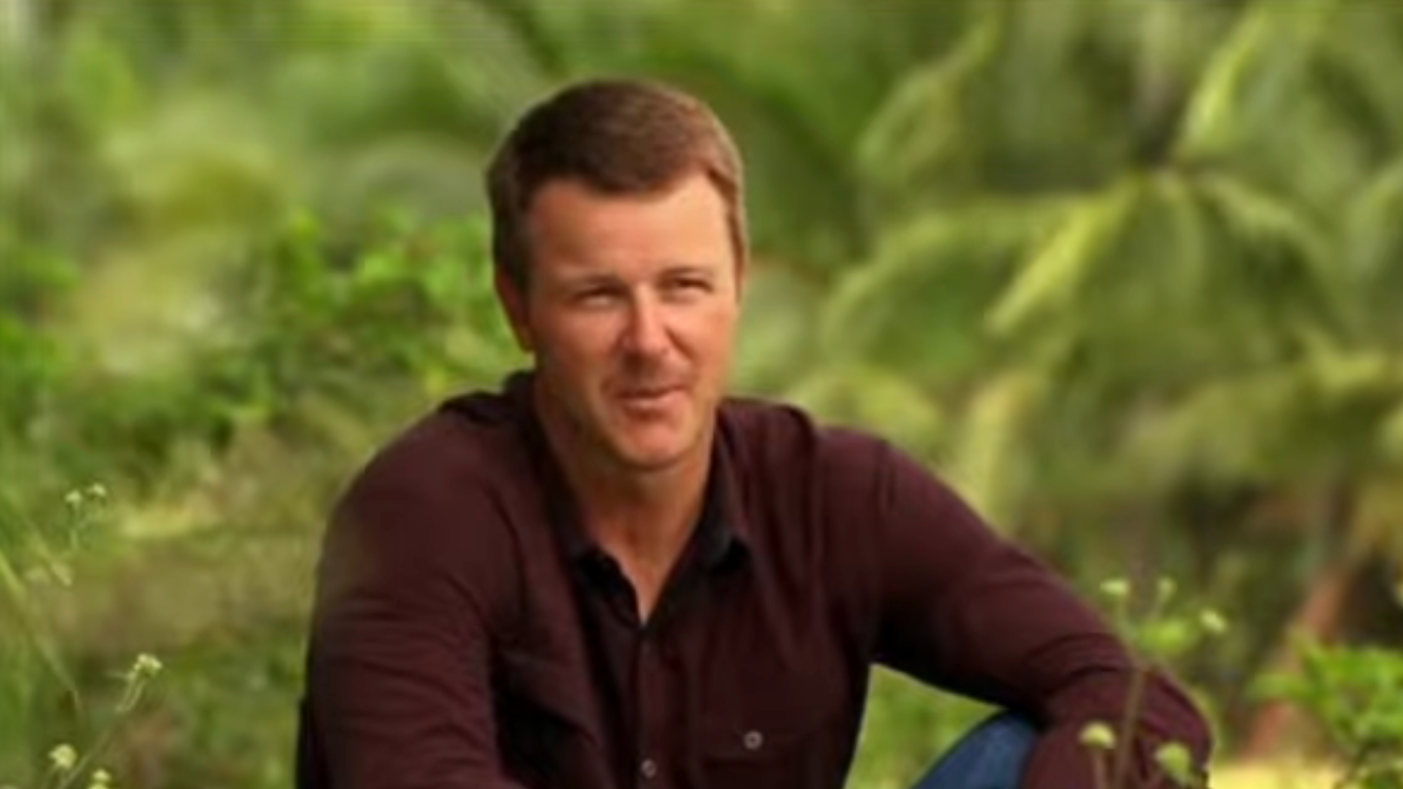 Jeff Kent talks in a confessional while wearing a button up shirt on Survivor.