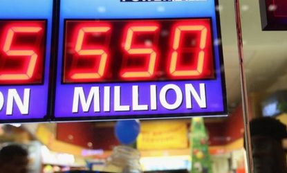  A sign outside the One Stop Mart in Chicago displays the record Powerball jackpot.