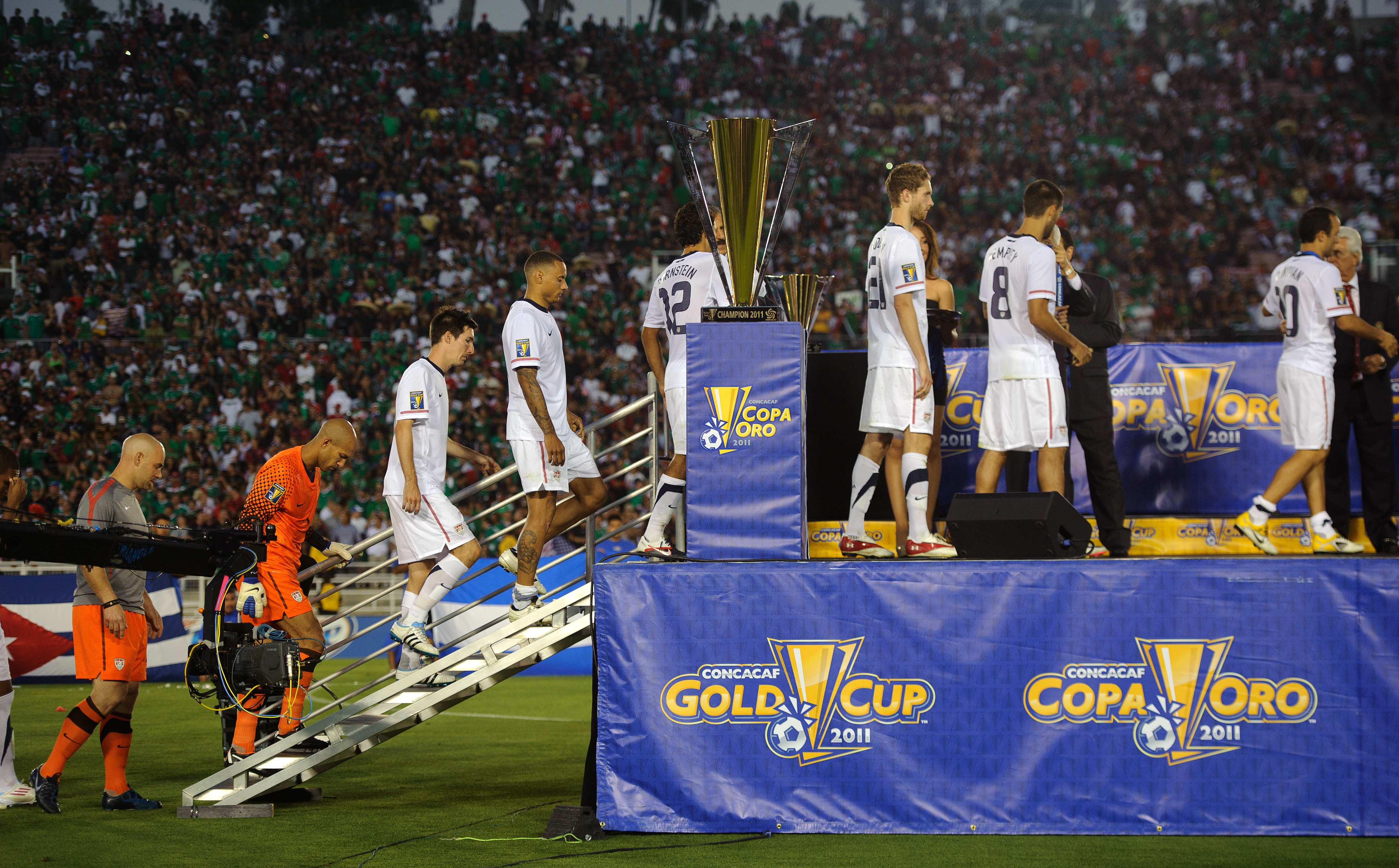 United States players pick up their runners-up medals after losing to Mexico in the 2011 CONCACAF Gold Cup final.