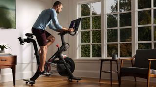 Man working out on an exercise bike at home