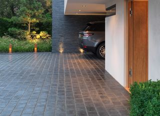 Block paving by Stonemarket in a stylish modern driveway, with a parked Range Rover