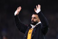 Mohamed Salah of Liverpool waves to the fans at full time during the Premier League match between Leeds United and Liverpool at Elland Road