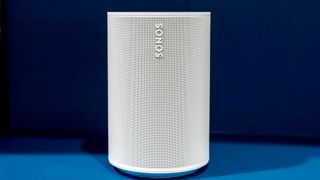 The Sonos Era 100 speaker in white on a shelf.