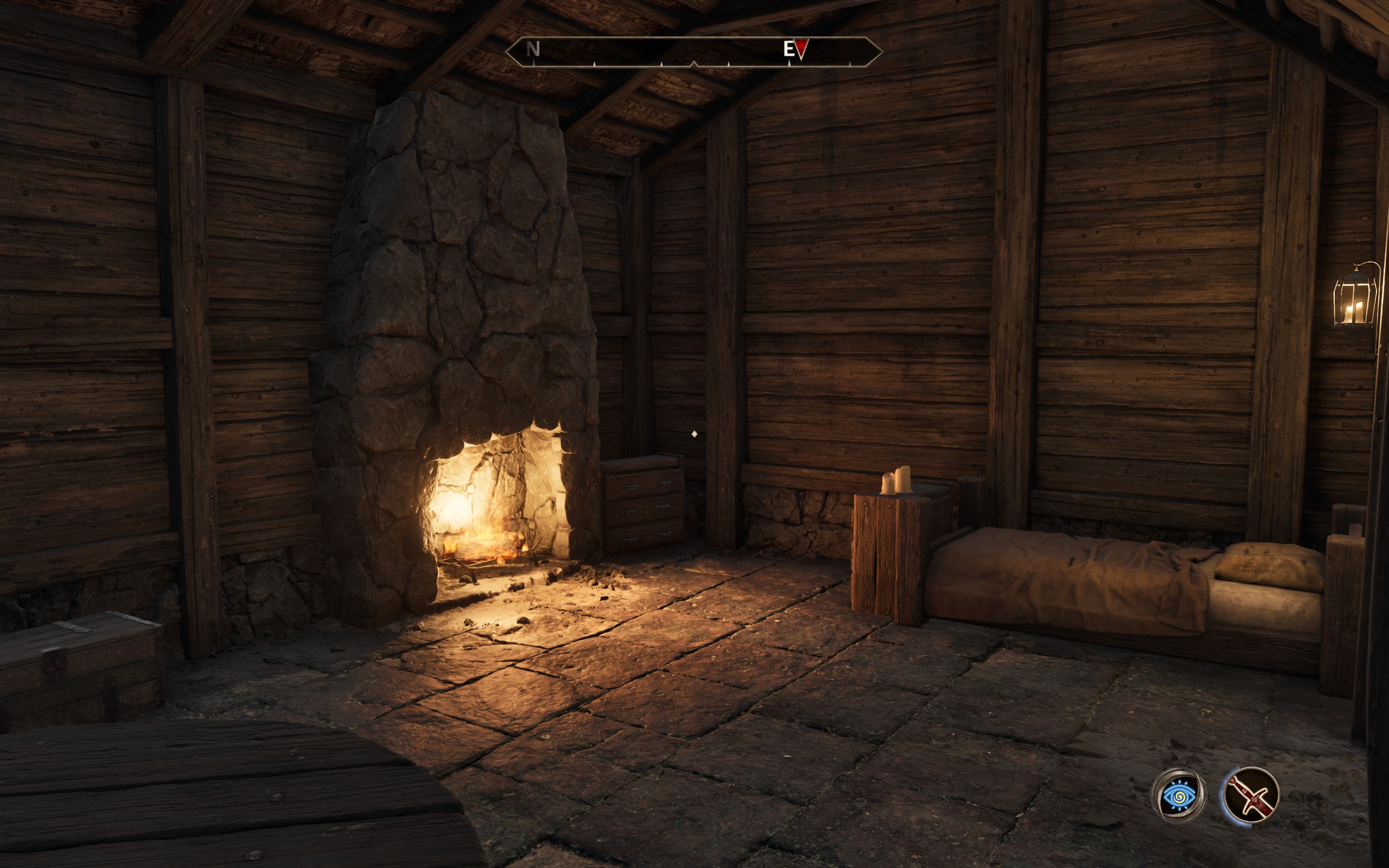 A bed next to a fireplace in a single-room house