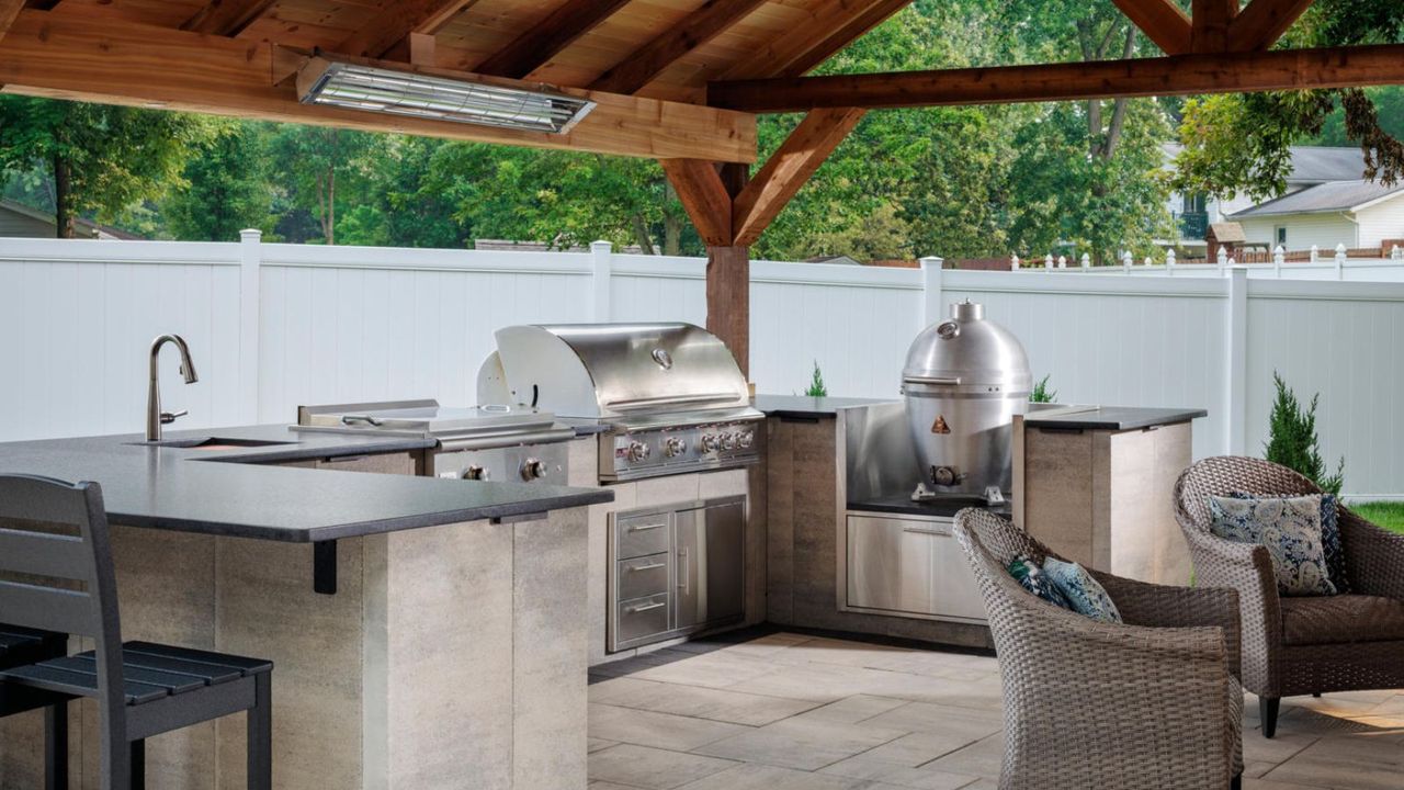 An outdoor kitchen with stainless steel appliances