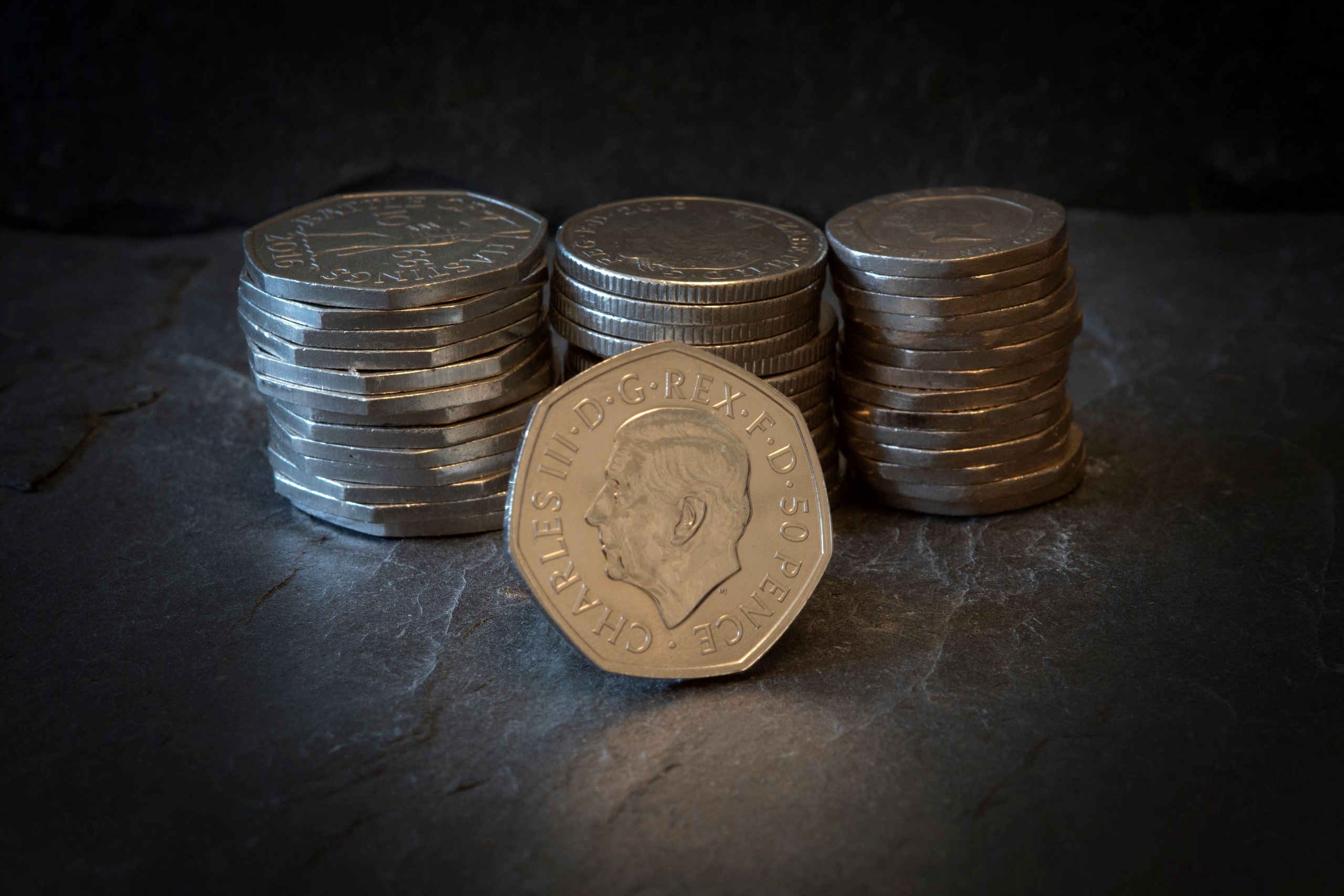 A stack of british 50p coins