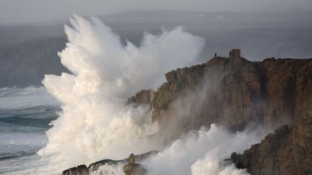 Wave crashing on rocks.