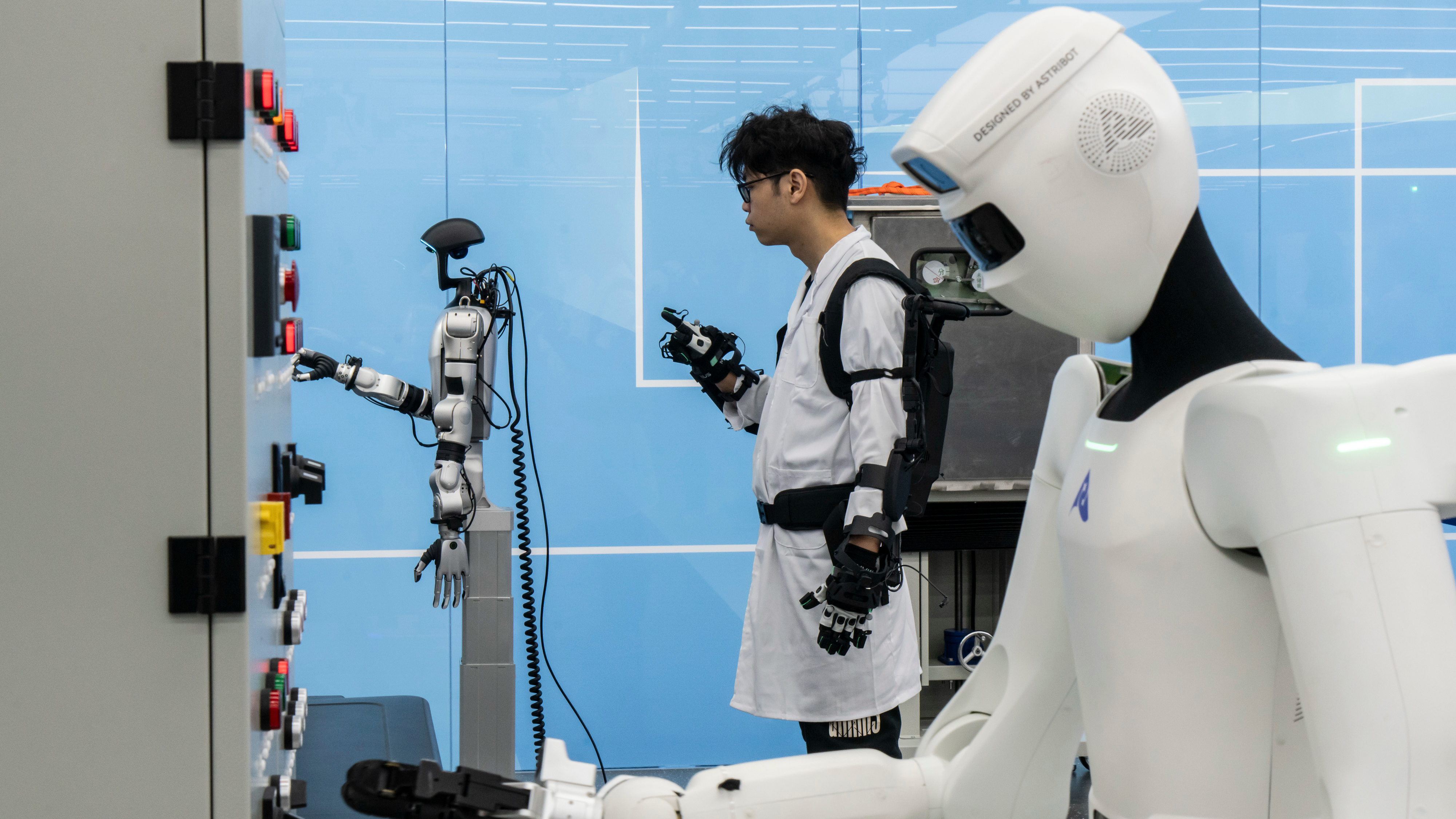 Employees at the China Southern Power Grid operating humanoid robots