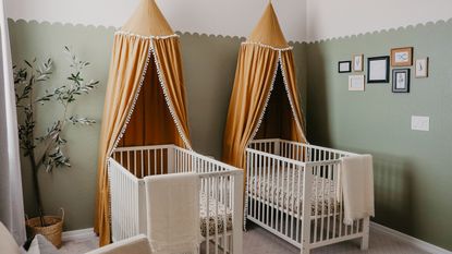 Twin nursery ideas by Taylor Follett with rust orange canopies