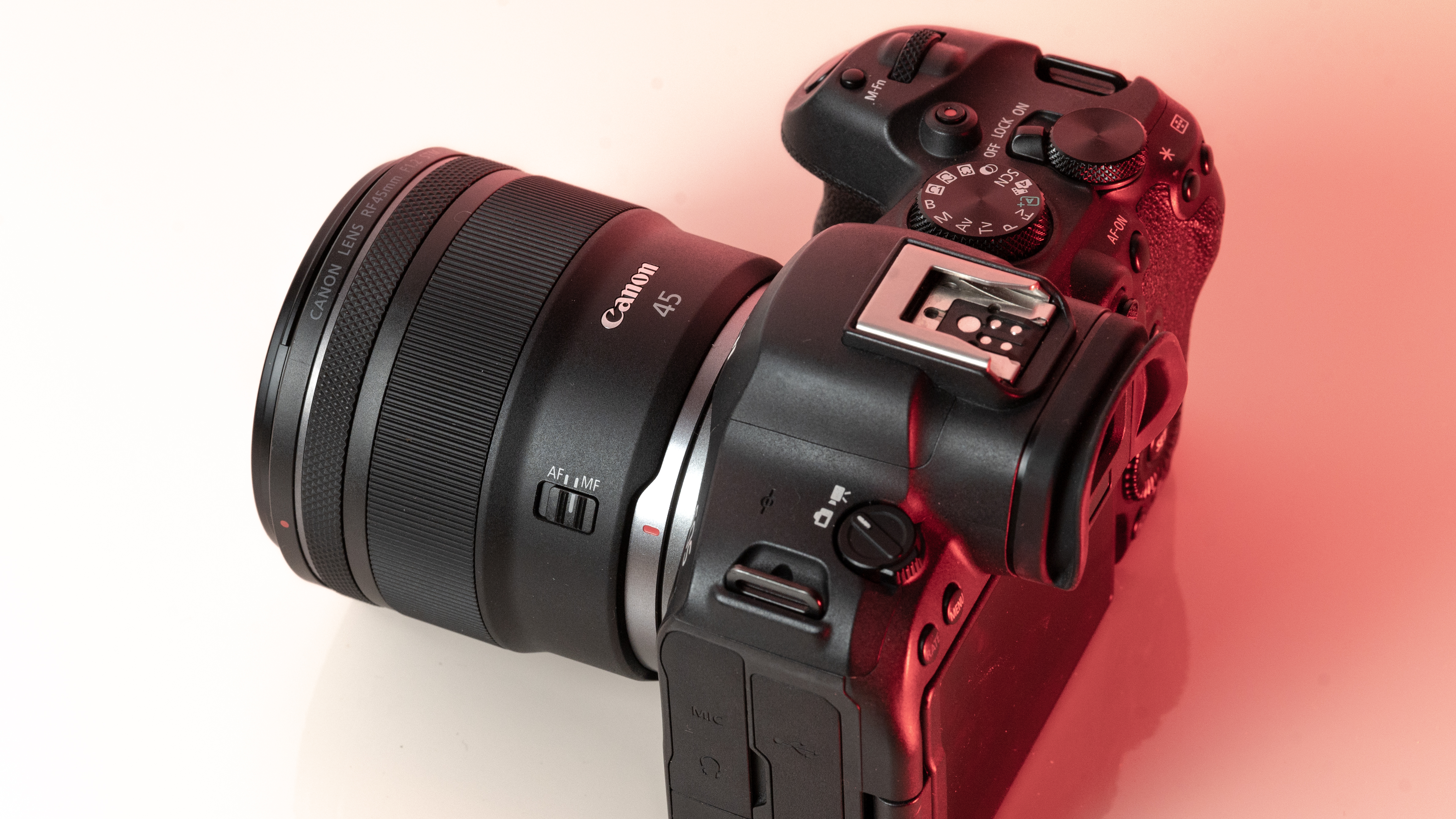 A picture of the Canon RF 45mm f/1.2 STM mounted on a Canon EOS R6 Mark II from the side.