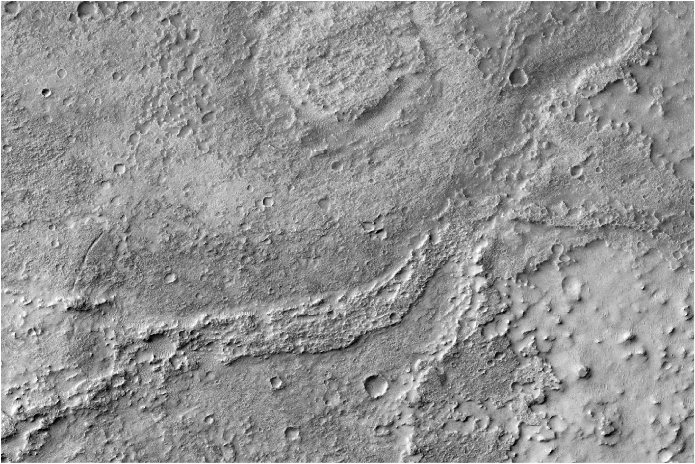 A gray-scale image of Mars' surface shows dried up river beds