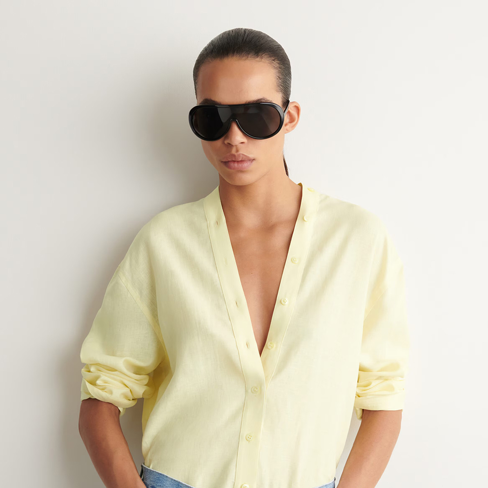 Cos model in sunglasses and yellow top