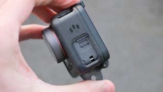 Akaso Brave 8 action camera held in a hand
