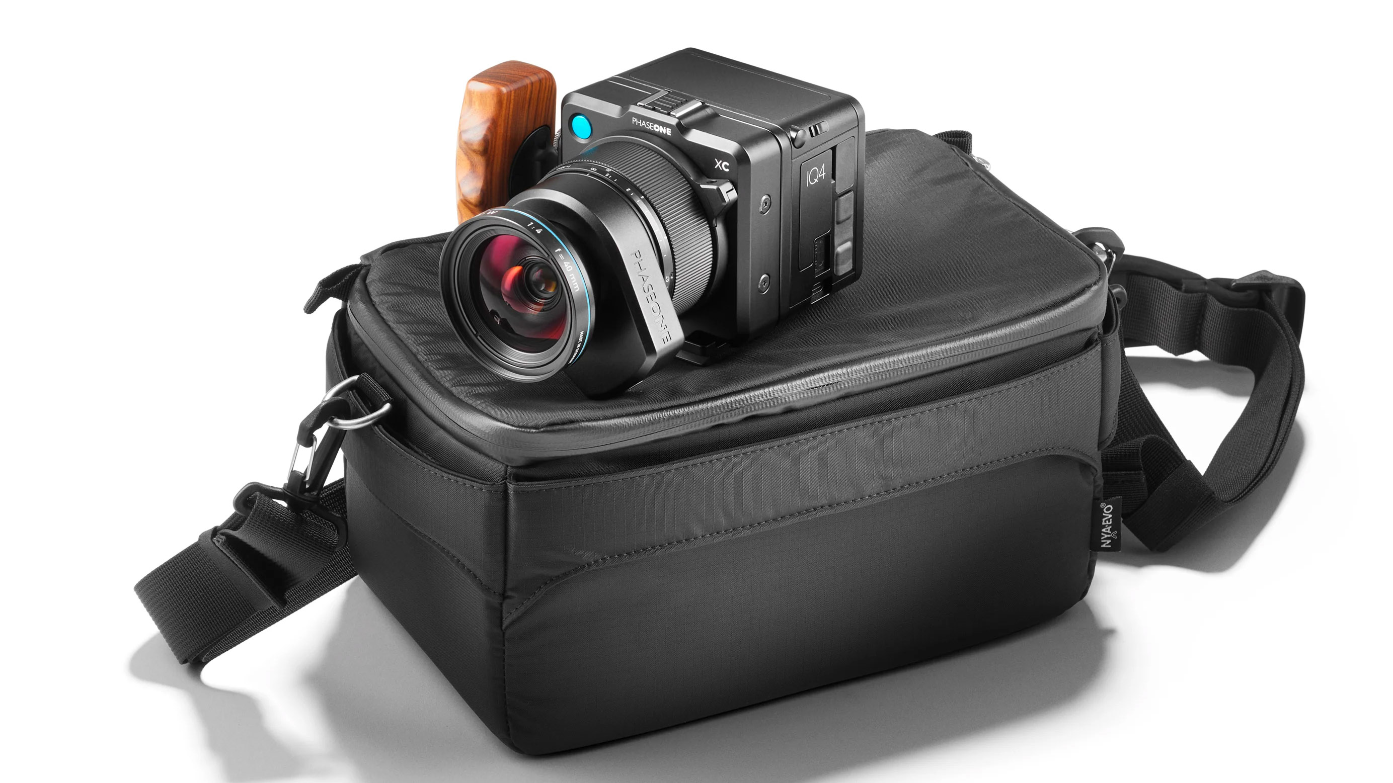 Phase One XC 40 on top of a black travel bag shot in the studio with a white background