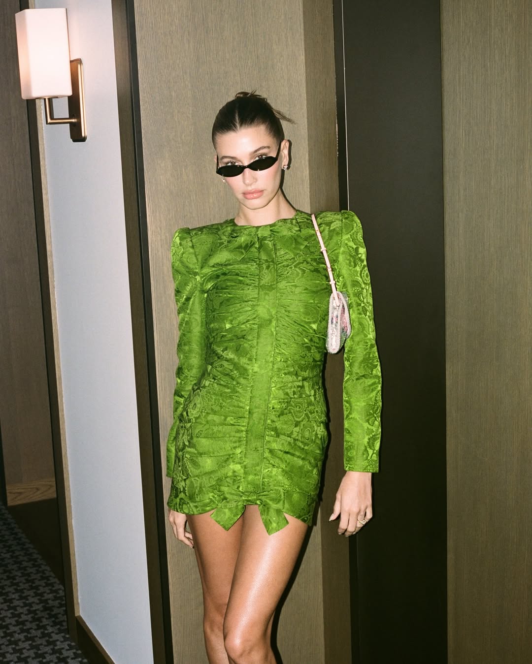 Hailey Bieber wearing a Valentino bag.