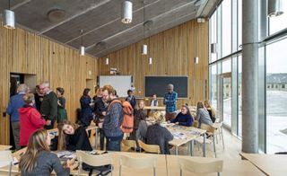 The complex focuses on drawing people together, with naturally lit classrooms