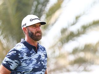 Dustin Johnson in his four aces polo shirt and TaylorMade hat