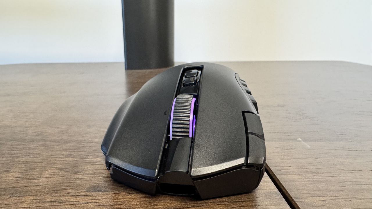 The Razer Naga V3 Pro on a wooden table from the front