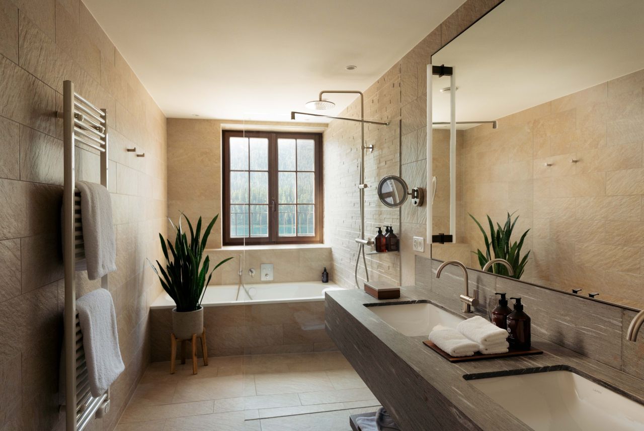 A hotel bathroom in warm beige tonea
