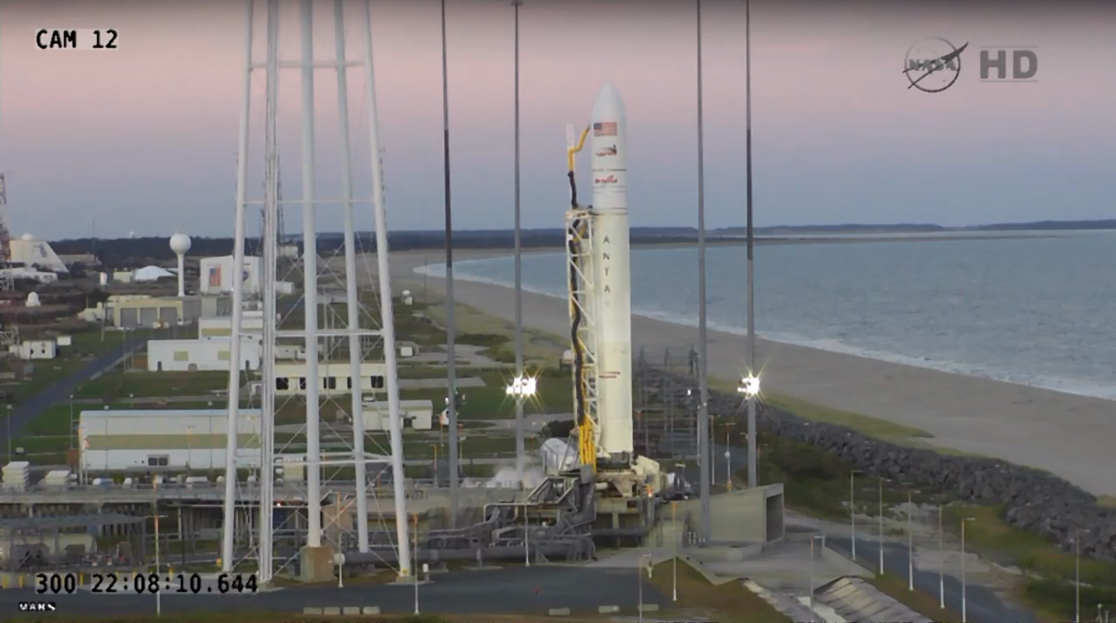 A private Antares rocket built by Orbital Sciences Corp. stands poised to launch a Cygnus cargo ship to the International Space Station on Oct. 27, 2014. A stray boat in the launch safety range forced flight controllers to postpone the launch for safety r