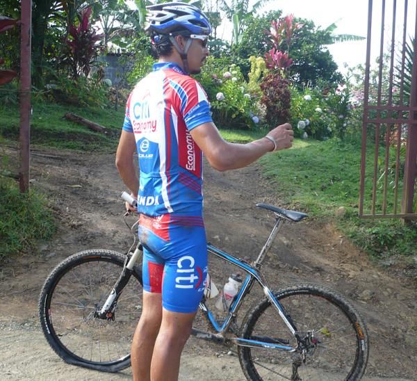 Luis Mejia Sanchez waits for help from a passing racer.