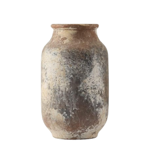 a rustic, farmhouse vase on a white background