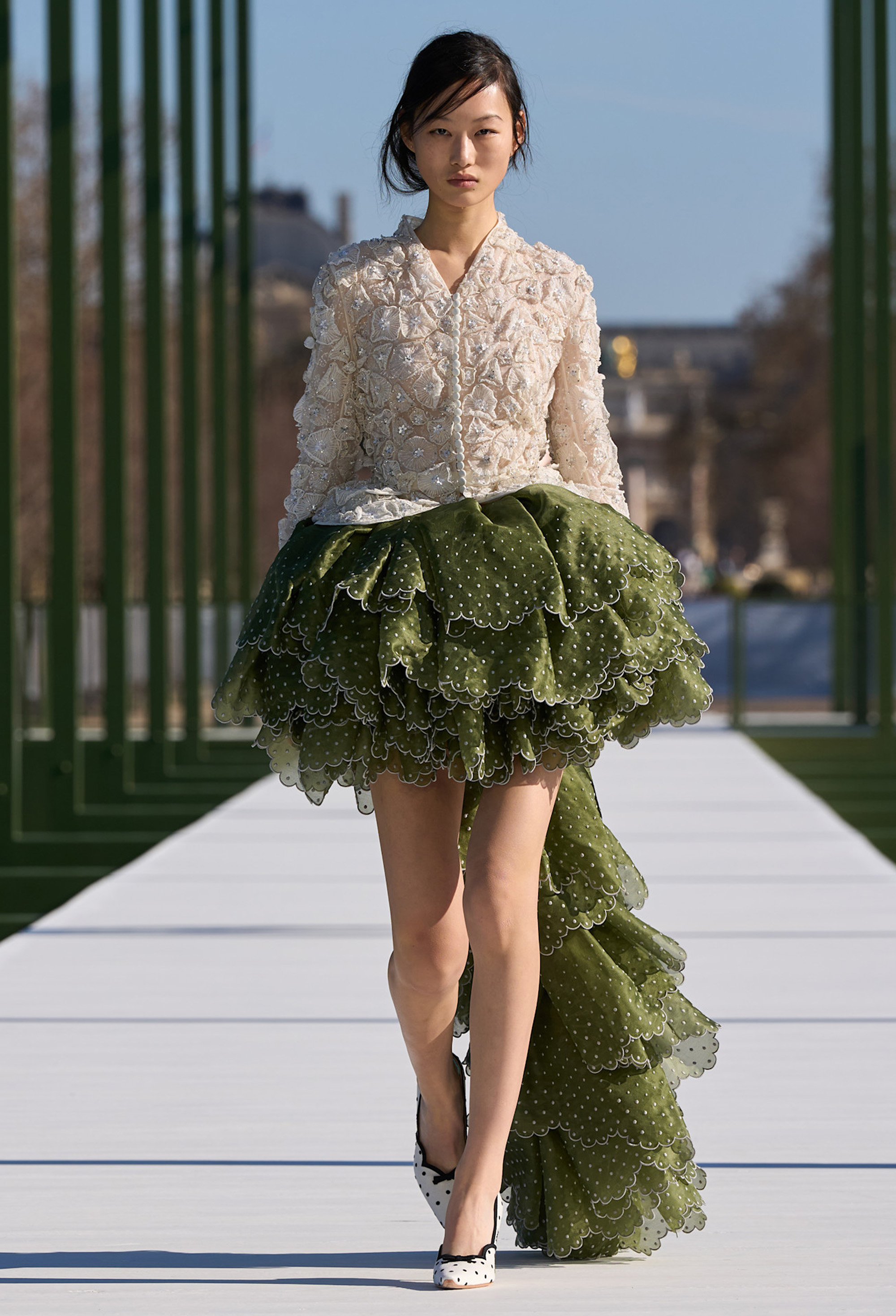 Runway model wearing the romantic fashion trend.