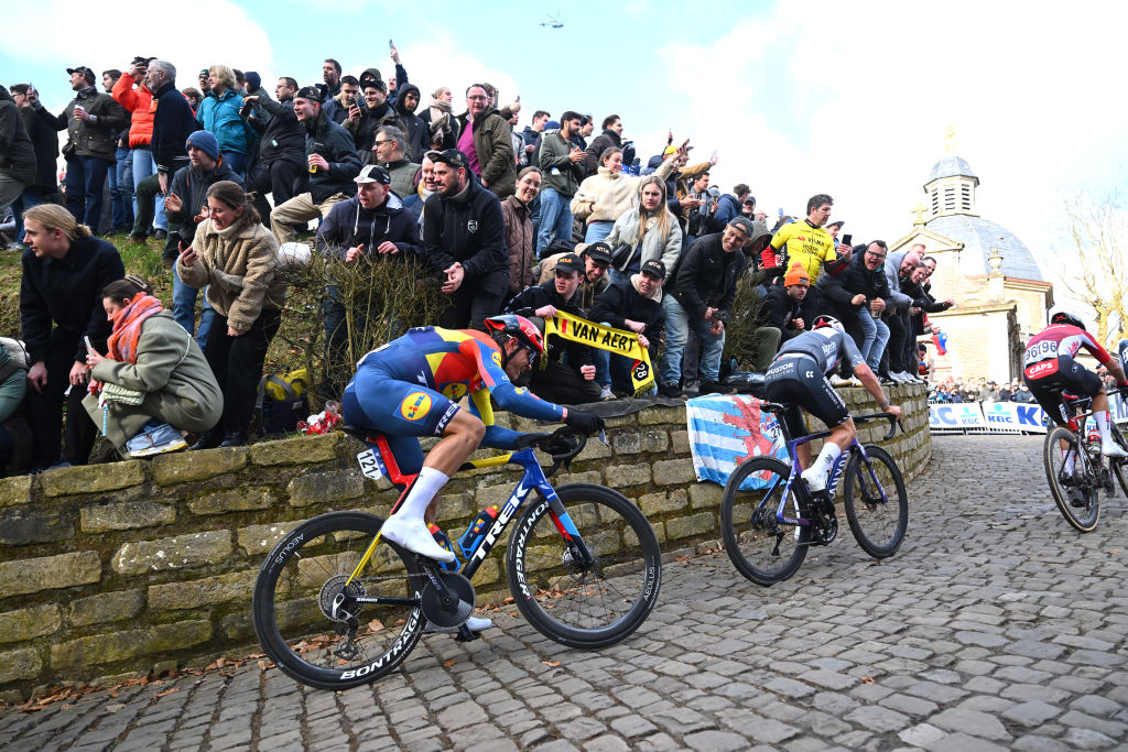NINOVE, BELGIUM - MARCH 01: Jasper Stuyven of Belgium and Team Lidl-Trek competes climbing the Muur van Geraardsbergen while fans cheer during the 80th Omloop Het Nieuwsblad 2025 - Men&amp;apos;s Elite a 197km one day race from Ghent to Ninove / #UCIWWT / on March 01, 2025 in Ninove, Belgium. (Photo by Luc Claessen/Getty Images)