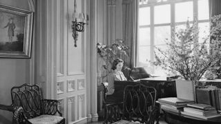 Princess Elizabeth plays the piano at the Royal Lodge in Windsor Castle, England on April 11, 1942.
