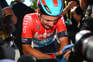 An emotional Victor Campenaerts celebrates winning stage 18 of the 2024 Tour