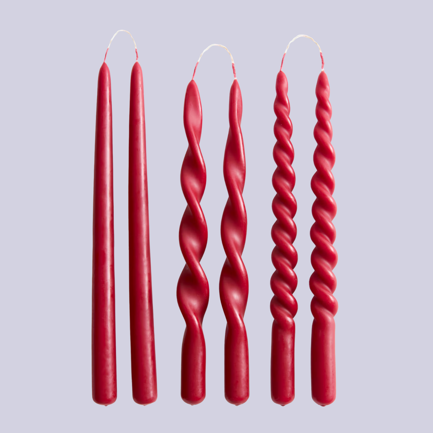 A set of six red taper candles