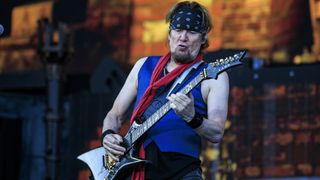 Adrian Smith on stage in 2025