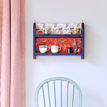 room with white wall with shelves