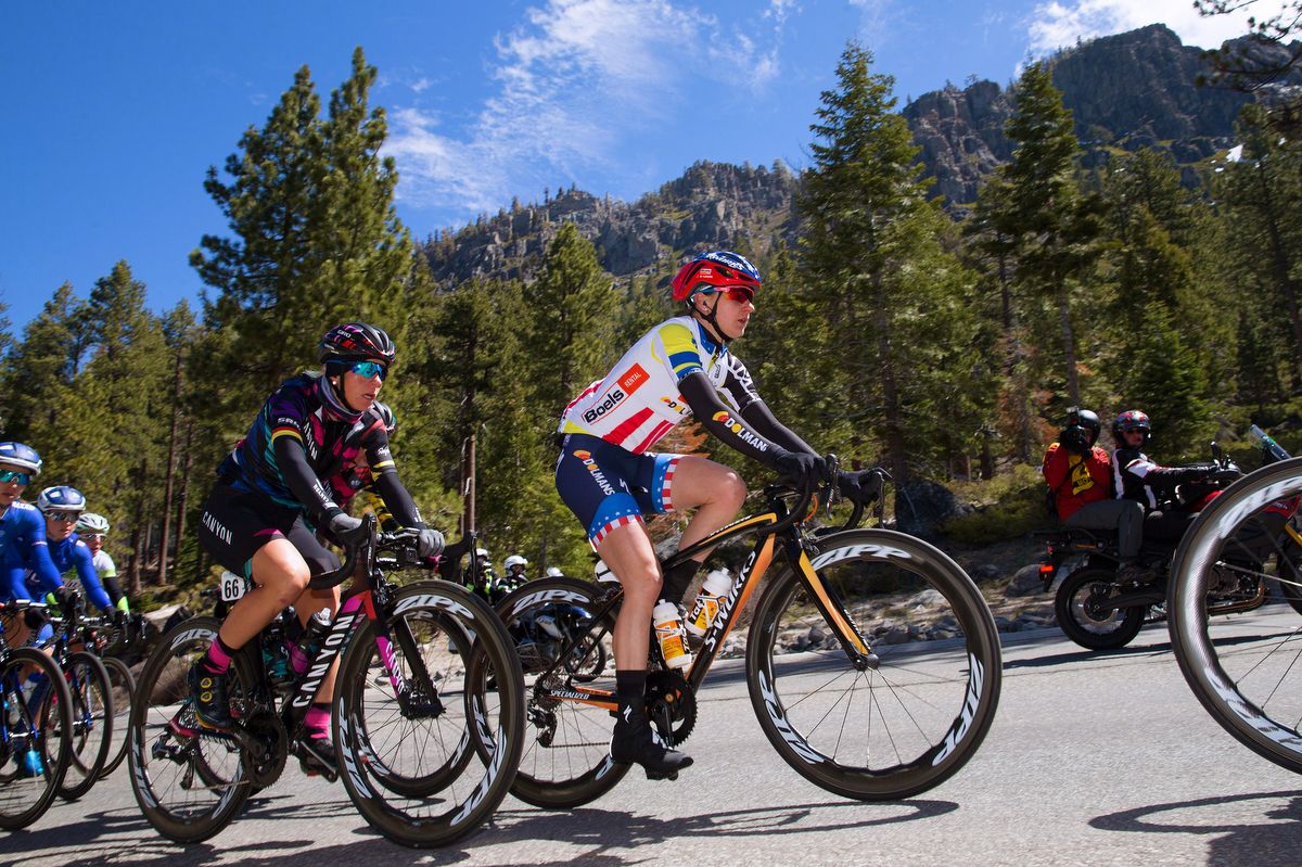 Race leader Megan Guarnier covers up her yellow jersey