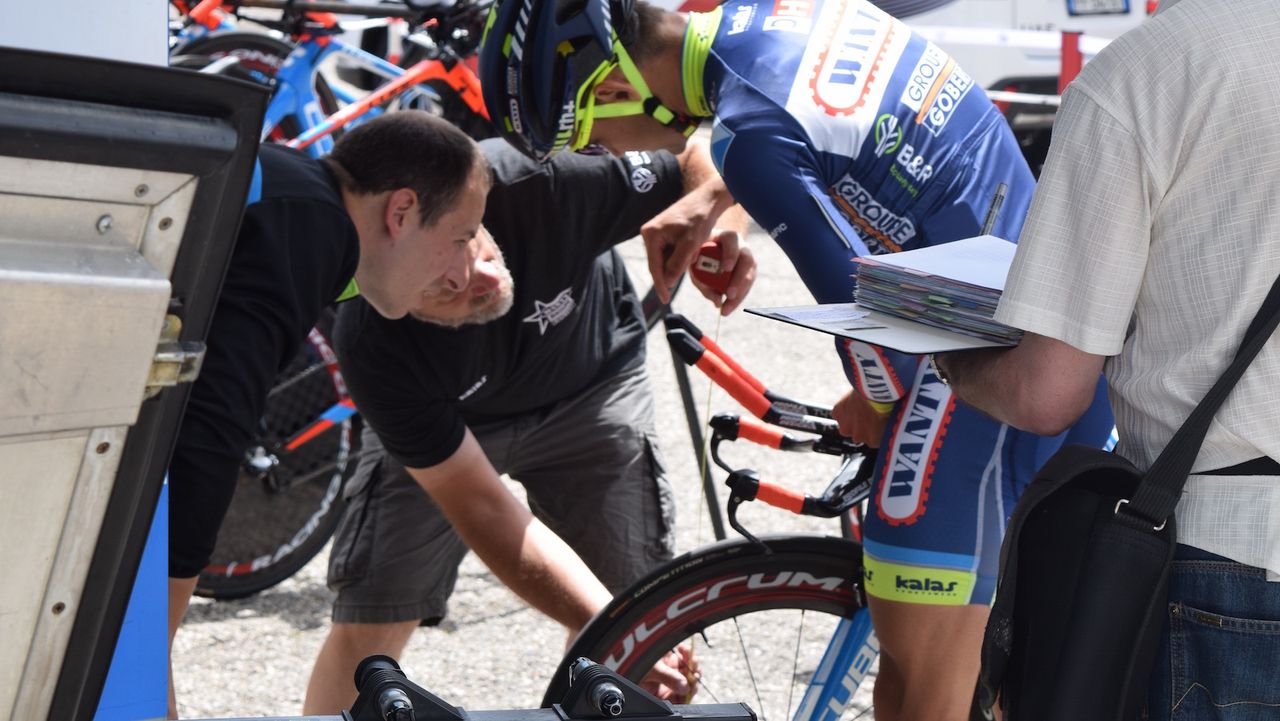 Wanty-Groupe Gobert mechanics double check handlebar setups for their riders