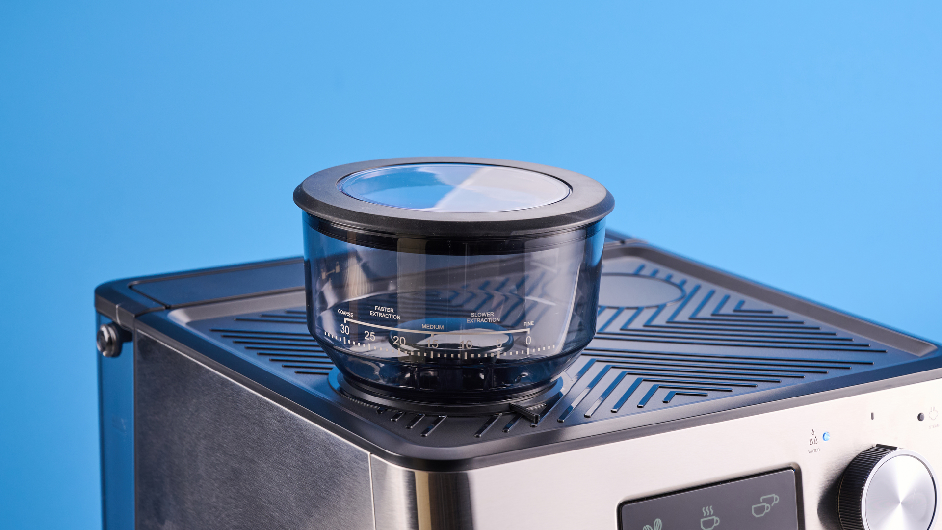 the gevi espresso machine with grinder showing its bean hopper, steam wand, and control screen with a silver dial and drip tray