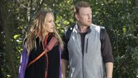 Teddy Altman (Kim Raver) and Owen Hunt (Kevin McKidd) look toward some injured people while taking a hike on the Season 20 episode of Grey's Anatomy, "Blood, Sweat and Tears."