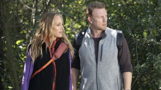 Teddy Altman (Kim Raver) and Owen Hunt (Kevin McKidd) look toward some injured people while taking a hike on the Season 20 episode of Grey's Anatomy, "Blood, Sweat and Tears."