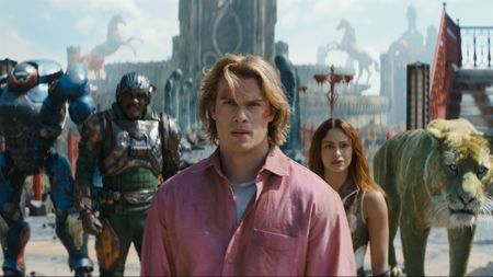 A close up of Adam/He-Man flanked by Roboto, Man at Arms, Teela, and Cringer in Amazon's 2026 movie adaptation of Masters of the Universe
