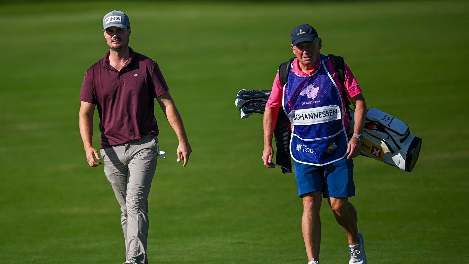 Kristian Krogh Johannessen walks alongside his caddie