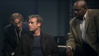 Jackie Earle Haley, Mark Valley, and Chi McBride in conversation in the office in Human Target.