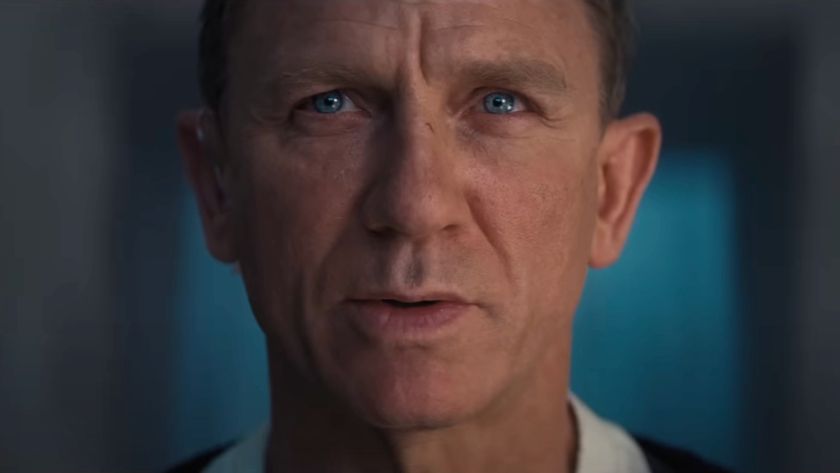 Daniel Craig gives a stoic hard stare in conversation in No Time To Die.