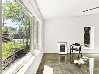 piure frame window at ground level of Hem House by Future Firm In Chicago