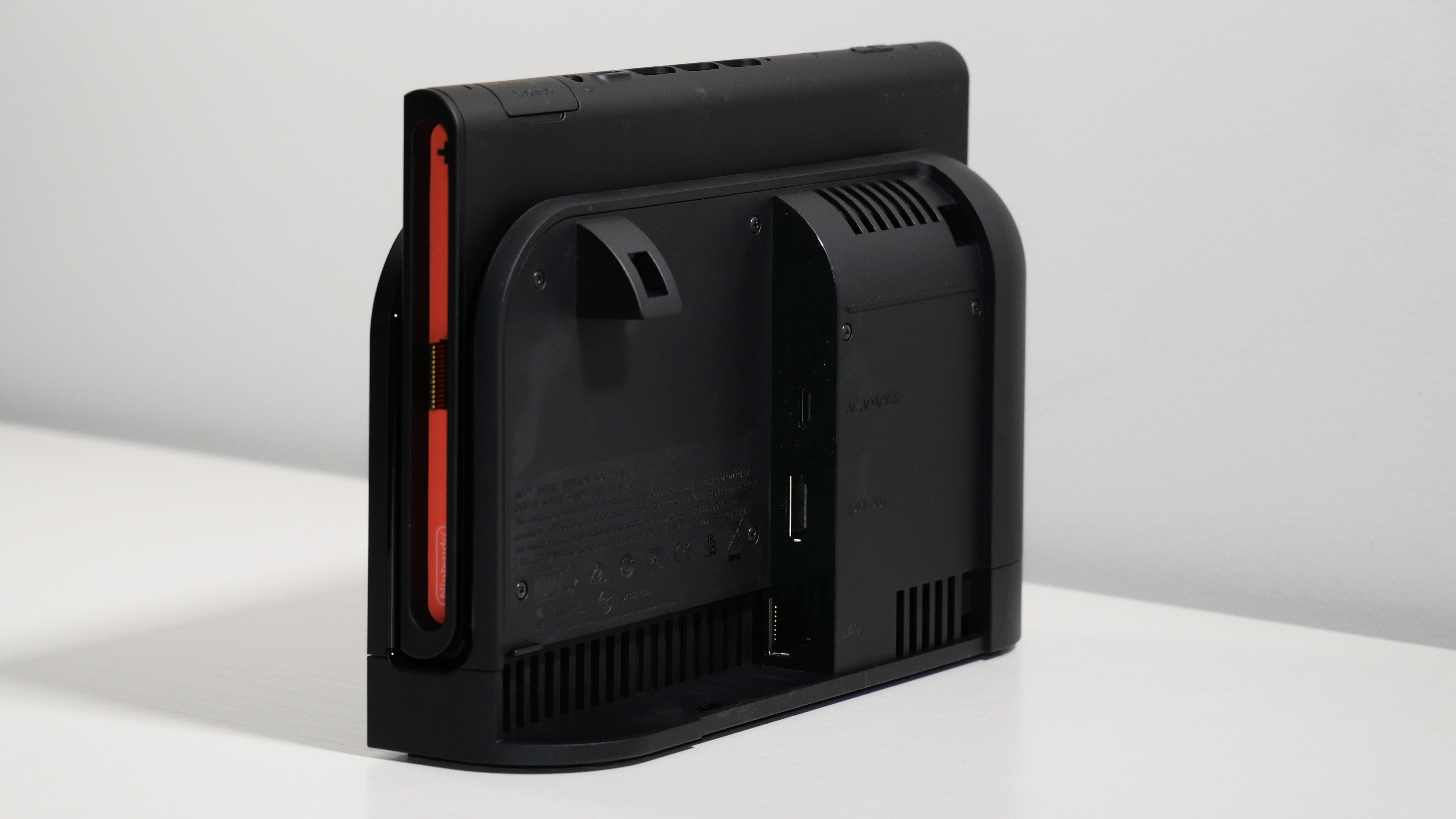 Nintendo Switch 2 docked on a white desk, highlighting the dock ports.