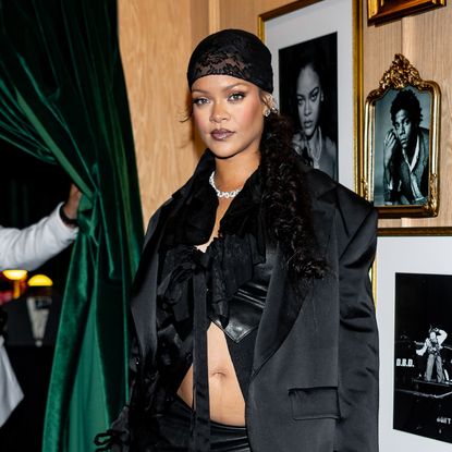 Rihanna wearing a scarf and diamond necklace.